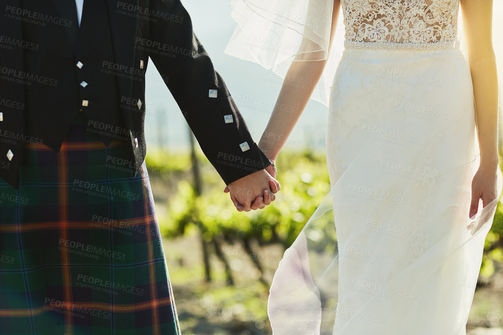 Buy stock photo Closeup, walking and couple with holding hands for wedding, married and bonding together in Scotland. People, bride and groom in zoom for special day, soulmate and commitment in marriage ceremony