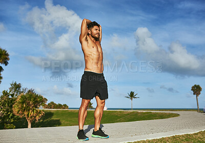 Buy stock photo Stretching, nature and man with arm exercise for running with race, marathon or challenge training. Fitness, blue sky and male sports athlete with muscle warm up for cardio workout outdoor in park.