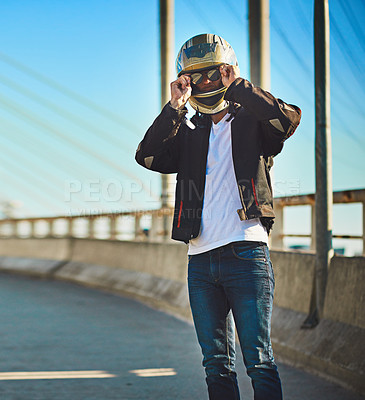 Buy stock photo Outdoor, man and bridge with motorbike helmet for transportation, ride and trip in Brazil. Male person, city and confident with travel, adventure and journey with drive with scooter on sunglasses