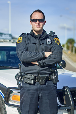 Buy stock photo Man, arms crossed and police officer for service, city and uniform for responsibility in town. Male person, law enforcement and cop on public patrol for security, sunglasses and authority in traffic