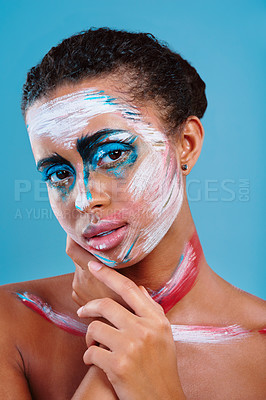 Buy stock photo Beauty, painting and portrait with woman in studio for designer, makeup and color palette. Unique, cosmetics and artistic with face of person on blue background for luxury, inspiration and fantasy