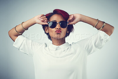 Buy stock photo Woman, pout and portrait with sunglasses in studio for summer outfit, fashion and stylish clothes. Person, pose and shades with confidence by gray background for trendy, eyewear and cool accessory