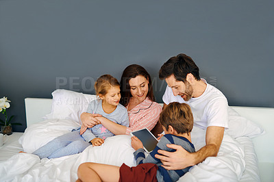 Buy stock photo Children, tablet and family bonding on bed in home for educational games, watching cartoon or mockup. Kids, digital app or comfort of parents in bedroom for online video or streaming service in house