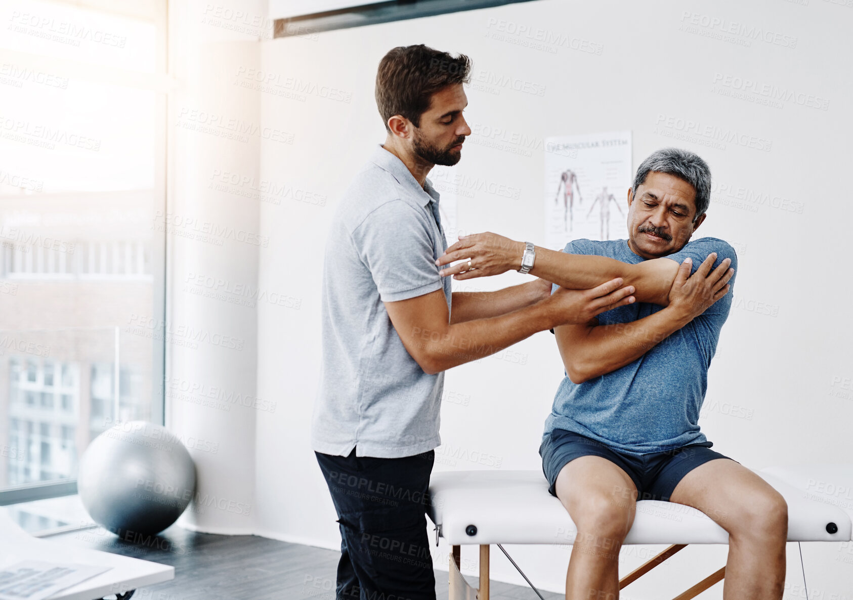 Buy stock photo Physiotherapist, stretching and mature man in clinic, helping and healthcare with exercise and fitness. Hospital, workout and physiotherapy of patient, rehabilitation and concentration of person