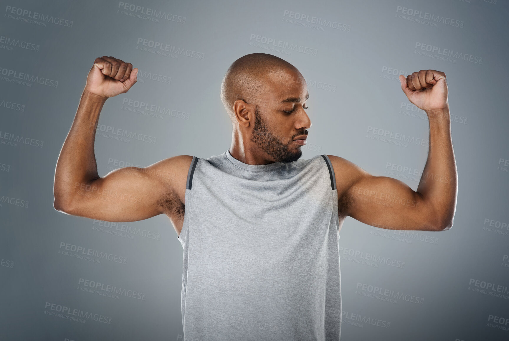 Buy stock photo Muscle flex, black man and confident in studio for fitness, workout and exercise on gray background. Male person, serious and trainer with sportswear with training for health, wellbeing and self care