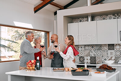 Buy stock photo Senior parents, happy couple and drinking wine to toast for cooking food to celebrate Thanksgiving. Generations, daughter and son in law at dinner party with family of people in home kitchen together