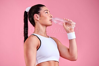 Buy stock photo Studio, woman and fitness with water for drinking, hydration and wellness after game competition. Thinking, female person and athlete for rest with h2o liquid, beverage and sports by pink background