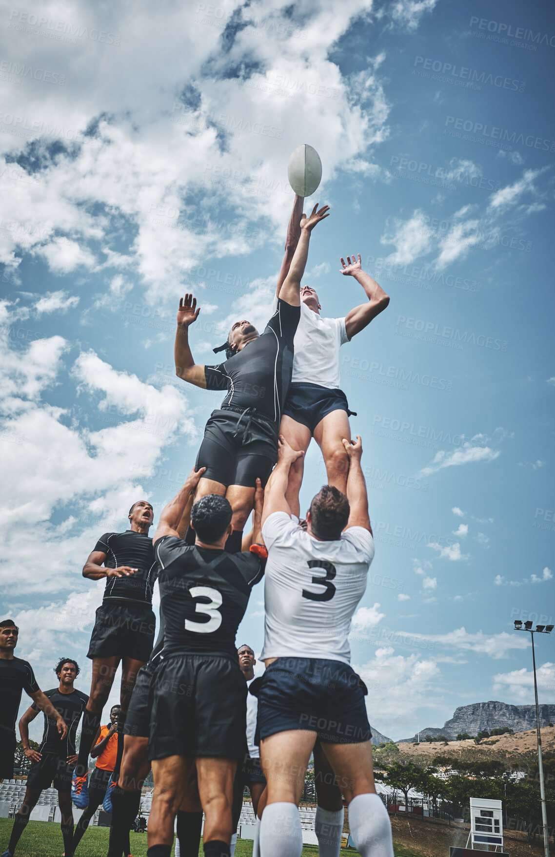 Buy stock photo Team, rugby player and tournament for sport, game or competition in exercise or fitness. People, athlete and recreation facility in challenge for outdoor, play or training center as together on field