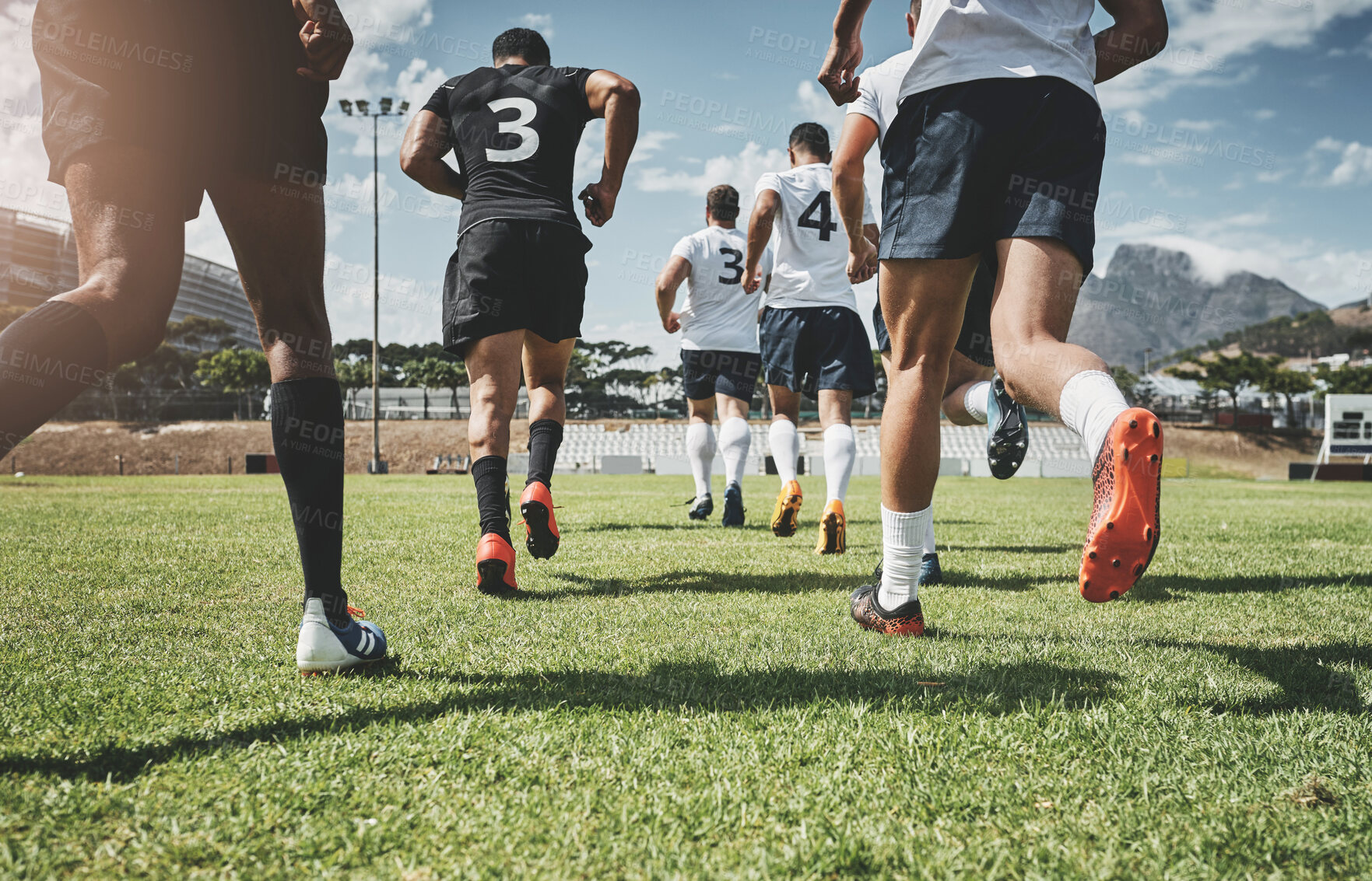 Buy stock photo Running, rugby and start with men on field for stadium, championship and premiership league. Teamwork, sports athlete and global competition with back of people in football club for tournament games