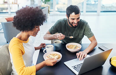 Buy stock photo Couple, smile and eating breakfast in home for morning routine, nutrition and cereal with laptop. Interracial people, happy and porridge at dining table for wellness diet, start day and healthy food