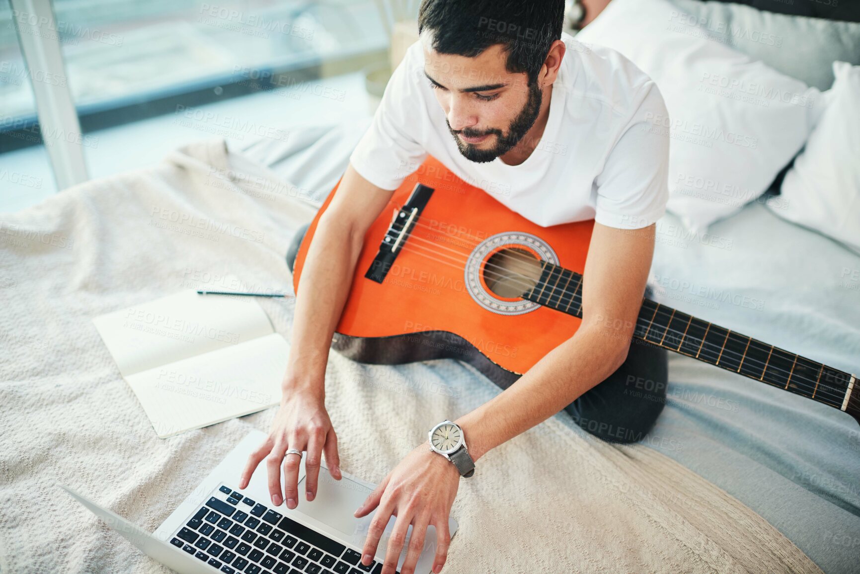 Buy stock photo Man, laptop and and guitar at home for music, production or hobby performance on social media. Musician, talented artist or acoustic guitarist with musical instrument for sound, audio or rhythm notes