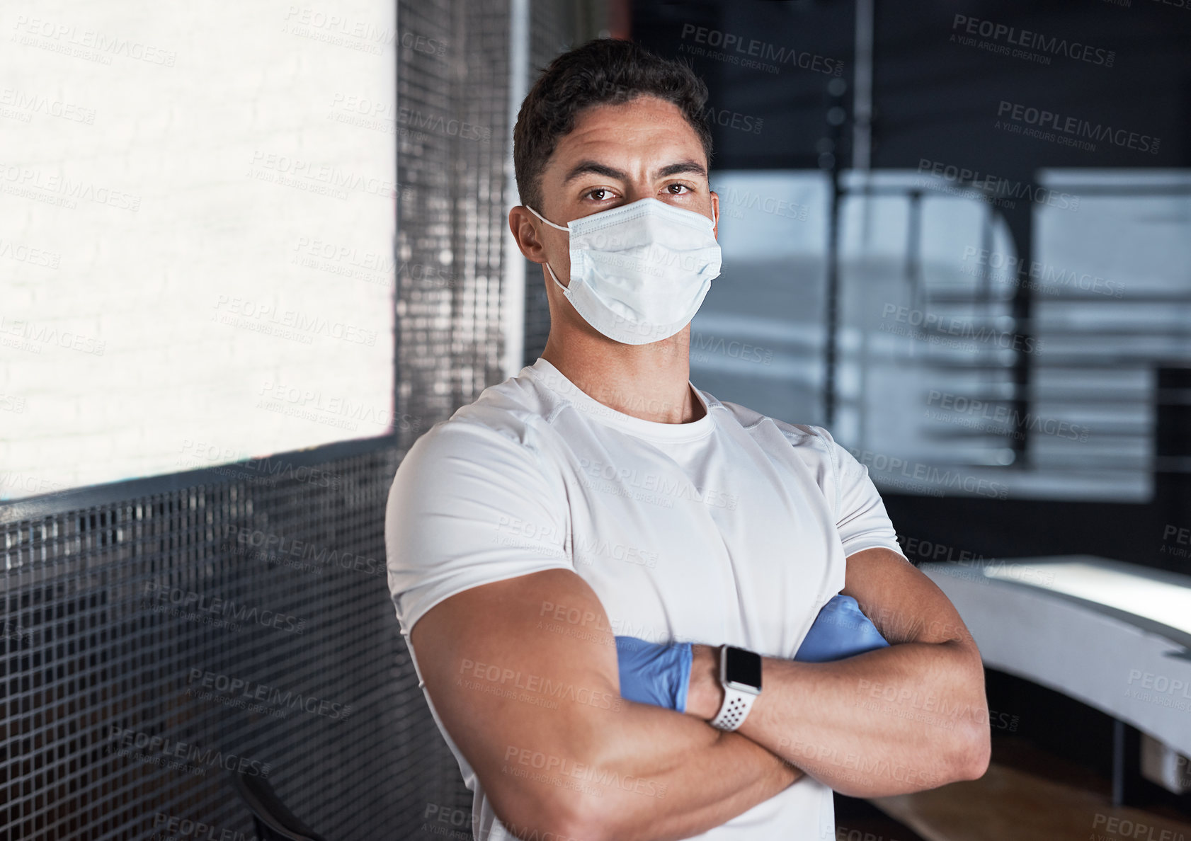 Buy stock photo Health, mask and portrait of man at gym with confidence, safety and compliance for workout hygiene at front desk. Rules, ppe and employee at fitness club with pride, virus protection and arms crossed