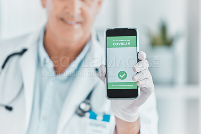 Buy stock photo Doctor, hand and phone with QR code for covid 19, info or vaccine status in hospital. Healthcare, professional man or screen of mobile with barcode, scan or contactless payment option in consultation