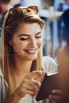 Buy stock photo Woman, smile and relax with tablet at cafe for dating app, communication and message on platform. Person, happy and scroll with tech at restaurant for profile match, response and online conversation