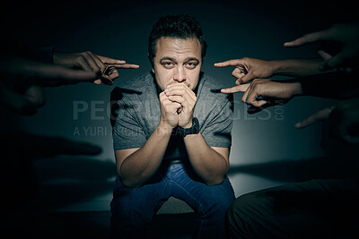 Buy stock photo Mental health, pointing and psychology with man in studio on dark background for rehabilitation. Blame, shame and victim with bipolar patient person in spotlight for healthcare or medical assessment