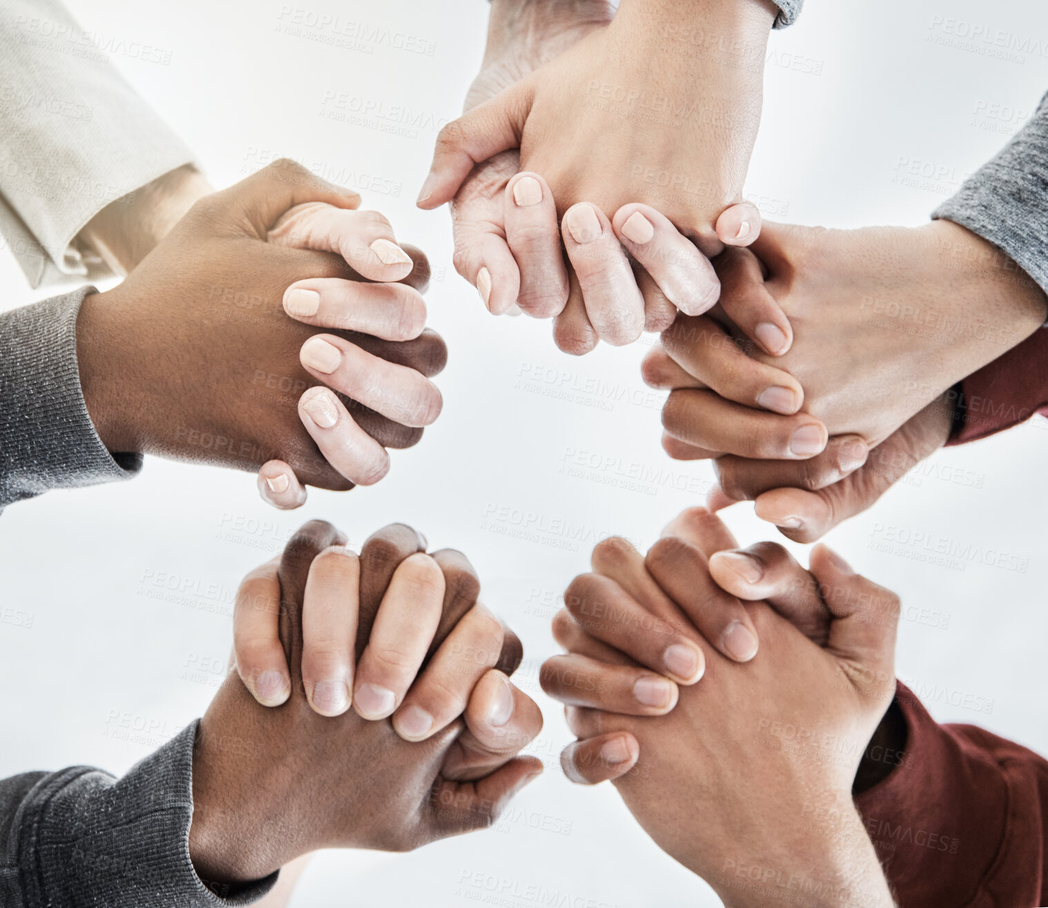 Buy stock photo Business people, trust and holding hands for collaboration, solidarity and support in low angle with unity. Creative agency, circle and coworking for connection, mission or team building with care