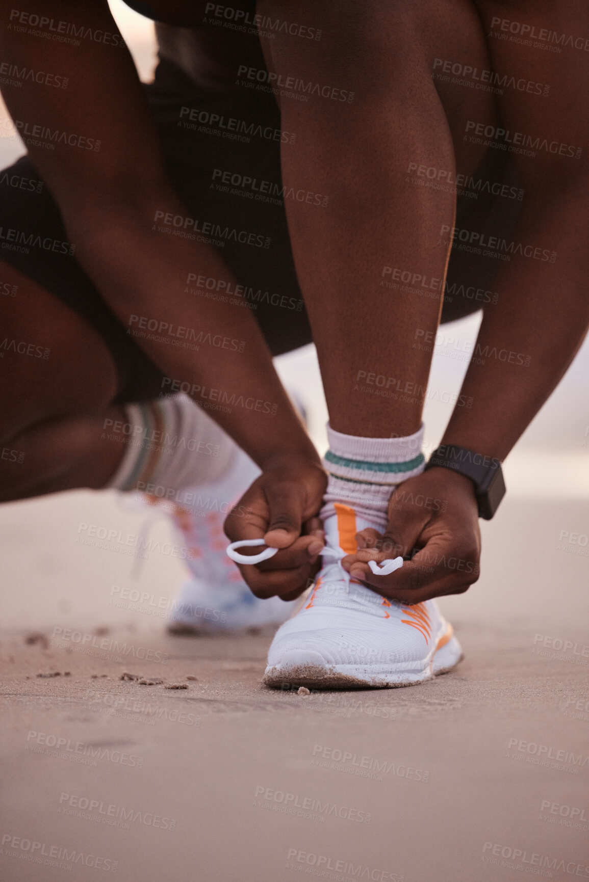 Buy stock photo Fitness, beach and hands of man with shoes for running, morning exercise and marathon training in nature. Sneakers, laces and runner on ocean sand getting ready for outdoor health workout at sunset