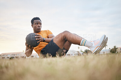 Buy stock photo Fitness, training and black man with ball for outdoor morning workout, wellness and challenge at park. Health, commitment and athlete on field for core muscle growth, development or exercise on grass