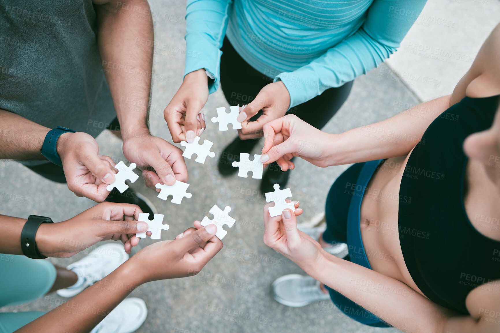 Buy stock photo Outdoor, people and hands with puzzle on fitness routine for creativity, teamwork and collaboration. Above, circle and building game for unity with cooperation, synergy and support for health 