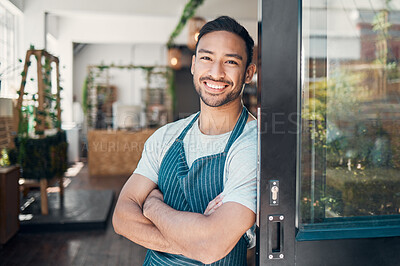 Buy stock photo Cafe, business owner and asian man in portrait for arms crossed, professional career and pride for welcome. Coffee shop, male person and barista in door for hospitality, customer service and smile