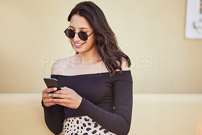 Buy stock photo Woman, sunglasses and holiday with phone in city for outdoor adventure, communication and travel update. Happy, smile and female person with technology by buildings for social media, post or vacation