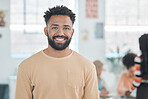 Portrait of a cheerful mixed race businessman standing in an office. Headshot of a confident hispanic male manager smiling and standing at work