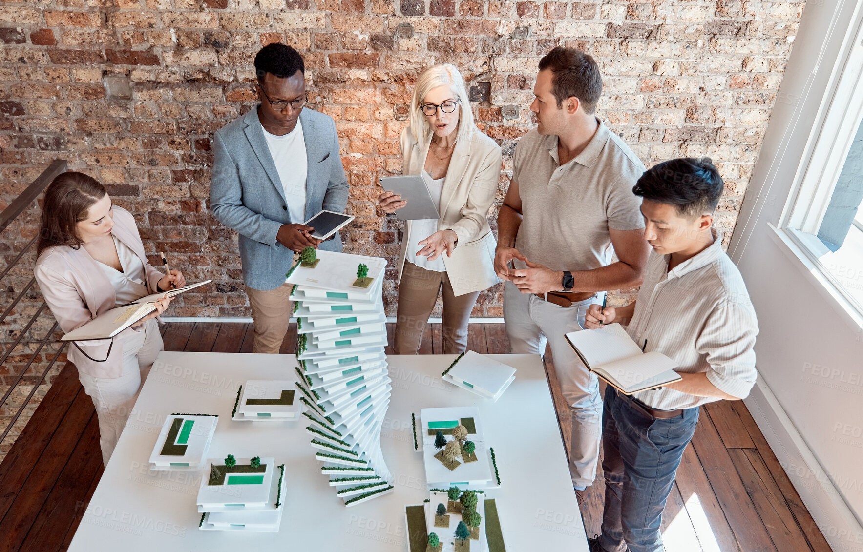 Buy stock photo People, building model and architecture planning in office for innovation, urban development and environment aware design. Engineer team, discussion and 3D structure in firm for property construction