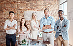 Group of diverse architects discussing plans, blueprints and schematics during a meeting in their office boardroom. Business people brainstorming and planning their upcoming project development