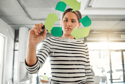 Buy stock photo Office, woman and marker with recycle logo on glass wall for eco friendly, environment and ecology. Business person, employee and serious with brainstorming or planning for green and sustainability