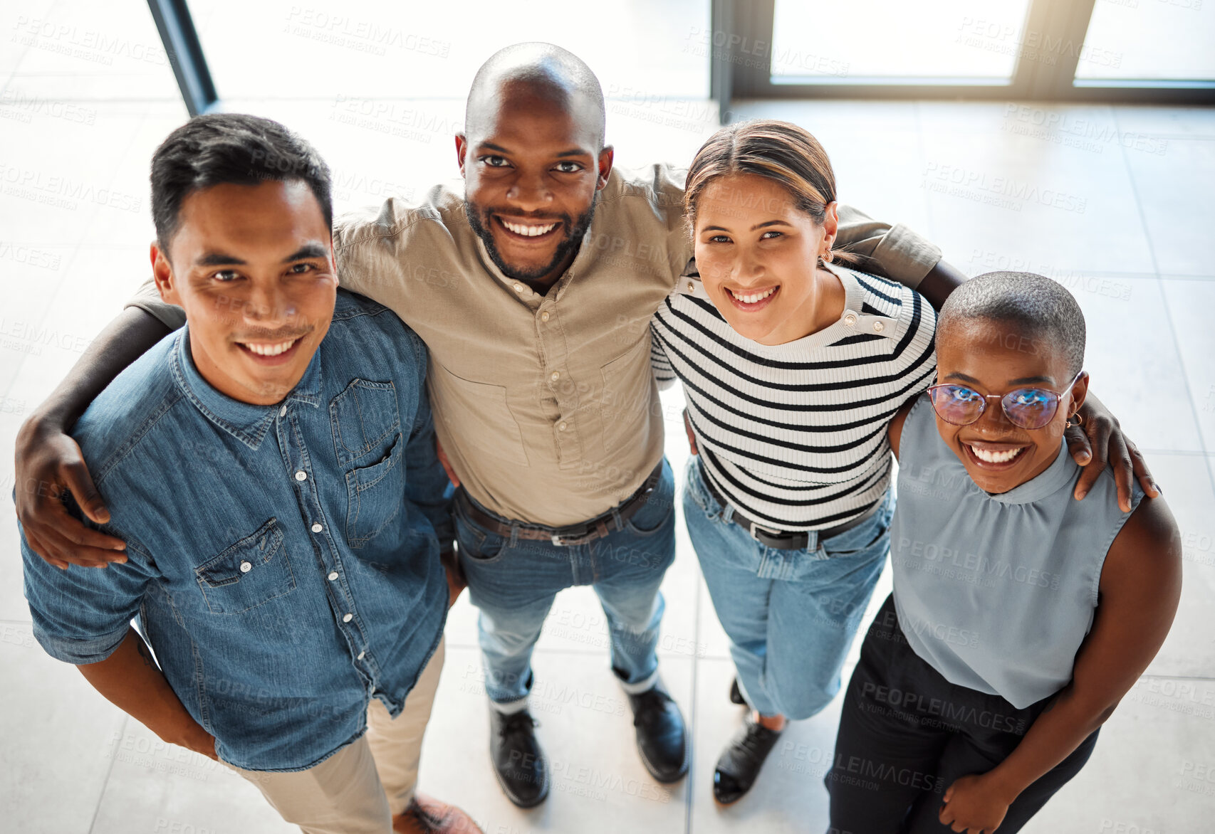 Buy stock photo Business people, portrait and team hug in office, startup and collaboration on project in lobby. Employees, high angle and colleagues in meeting with diversity, embrace and together for cooperation