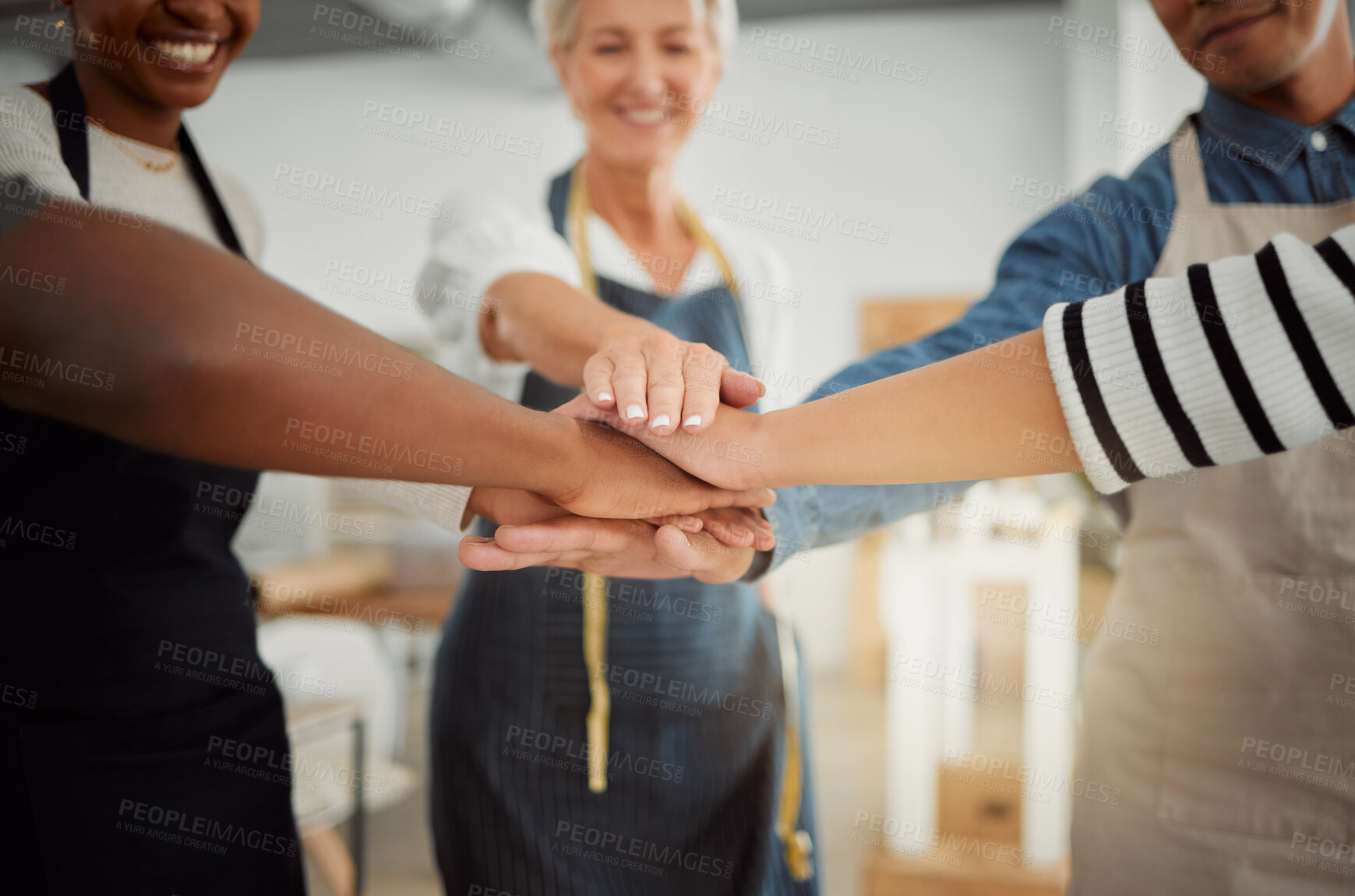 Buy stock photo Creative, stack and discussion for group, hands and solidarity in workshop, fashion designer and smile. Tailor, huddle and people in business meeting, teamwork and collaboration in design studio