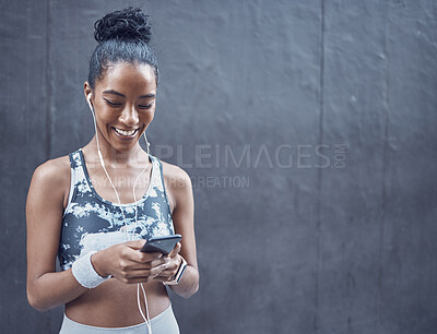 Buy stock photo Woman, runner and phone with earphones in street with smile, exercise or mockup space with music in city. Girl, smartphone and audio streaming for workout, fitness or health on sidewalk in Costa Rica