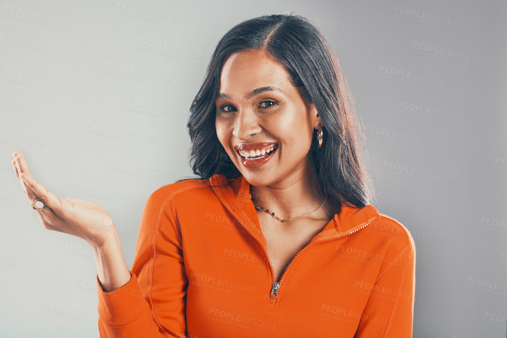 Buy stock photo Portrait, woman and palm for choice in studio with announcement, competition giveaway and retail sale. Smile, girl and hand gesture for advertising, coming soon and promotion vote on gray background