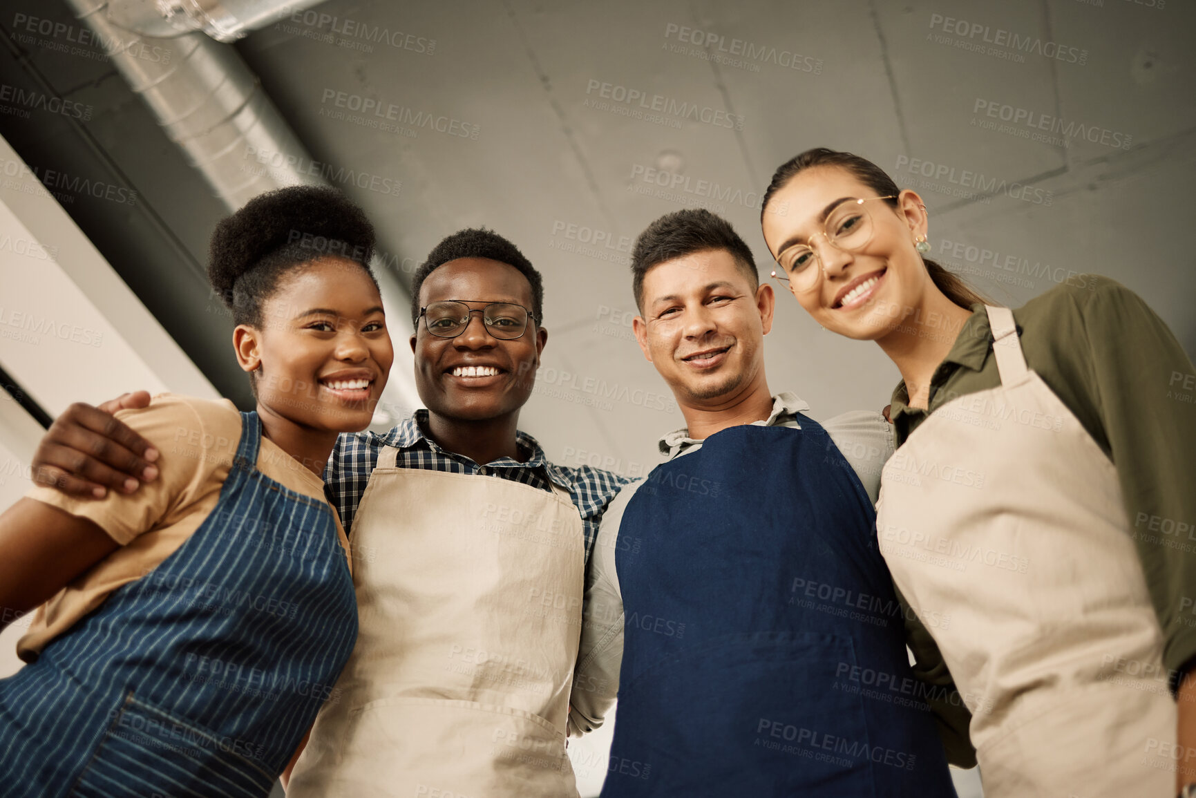 Buy stock photo Business, people and happy on hug as tailor with pride for teamwork, coworking and collaboration. Low angle, employees and smile on portrait for work break for creativity, clothes and manufacturing