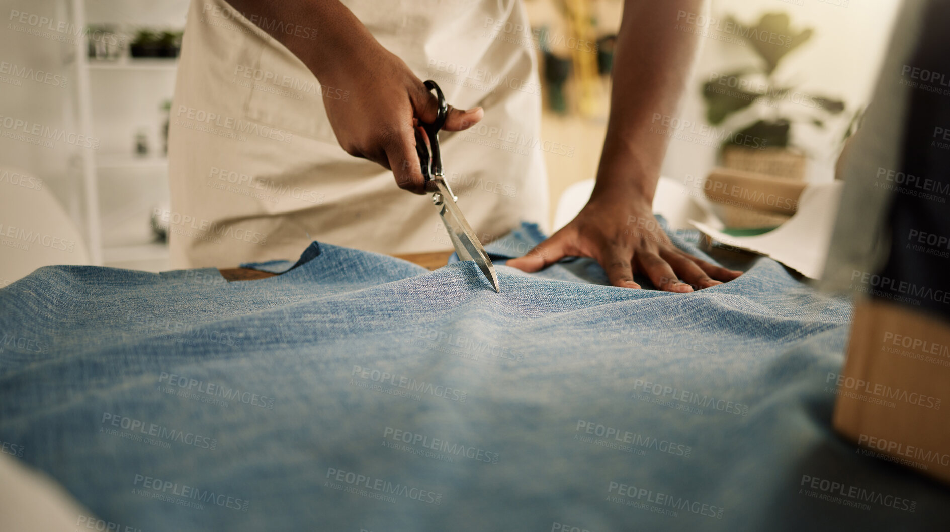 Buy stock photo Fashion, hands and person with fabric for cutting, creativity and manufacturing industry in workshop. Small business, tailor and scissors with material for pattern, textile production or professional