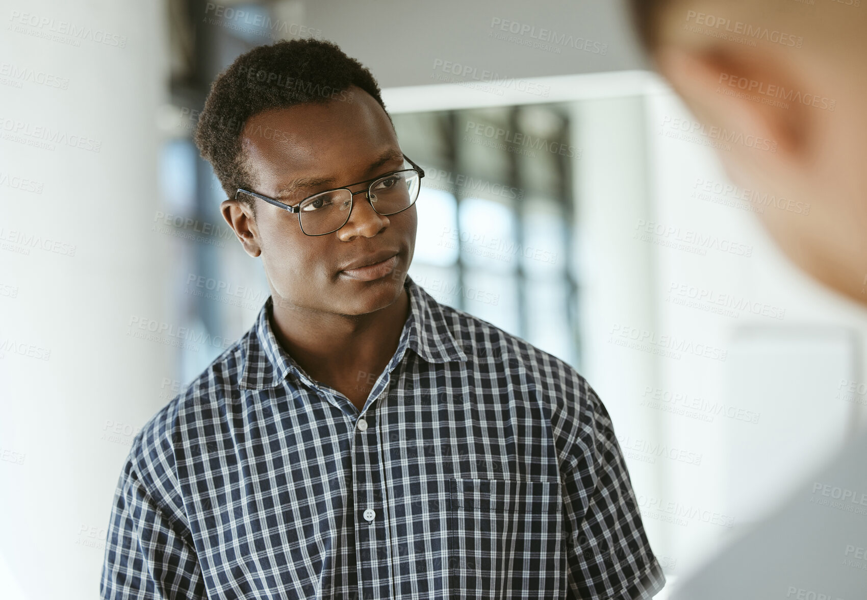 Buy stock photo Office, meeting and black man listening to discussion for teamwork, collaboration and brainstorming. Professional, startup company and business person for talking, conversation and communication