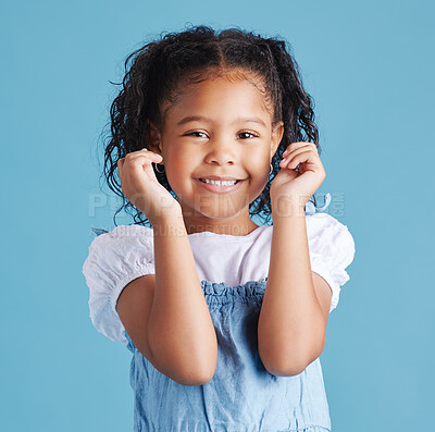 Buy stock photo Studio, child and girl in portrait for fashion, cool clothes and confidence with smile for kindergarten. Female person, happy kid or pride with hipster for preschool, style or blue background