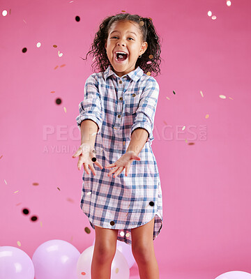 Buy stock photo Girl, child and throw confetti in studio and excited with shouting for celebration by pink background. Kid, happy and glitter for cheers, smile and balloons with decor at event for birthday party