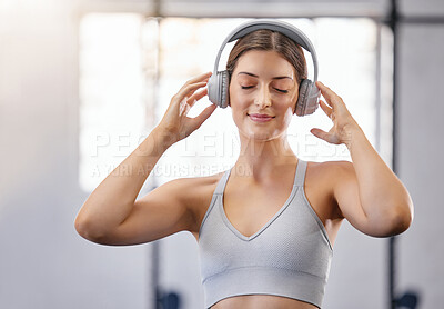 Buy stock photo Gym, woman and smile with headphones for music with fitness or exercise for body building. Female person, training center and happy with audio book or sound in sportswear for relaxation and break