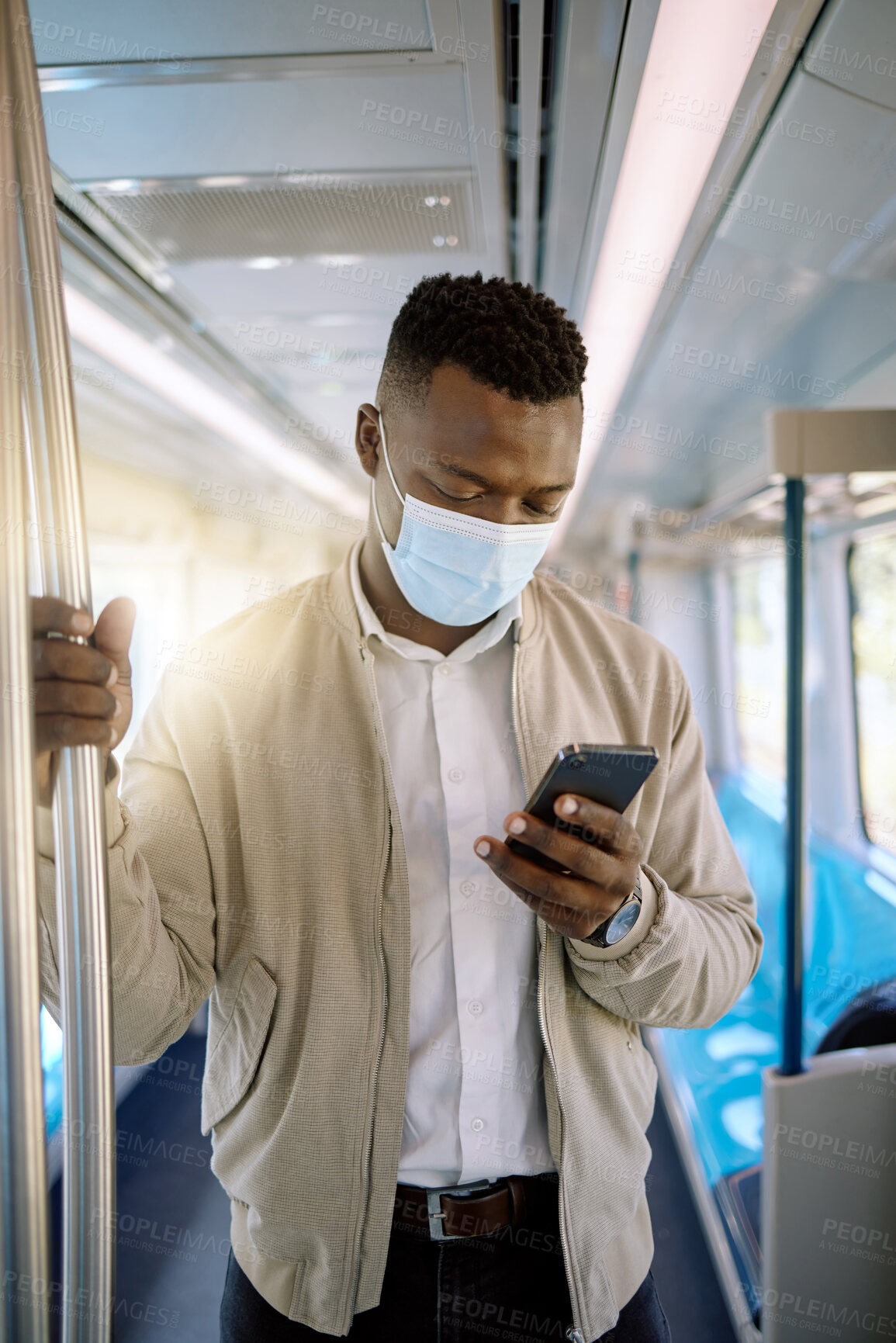 Buy stock photo Train, phone and business black man with mask for public transport, journey and work trip. Passenger, professional travel and person online on smartphone on subway, metro railway and commute in town