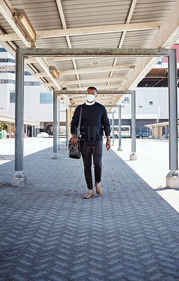 Buy stock photo Black man, walking and face mask for train travel with compliance, health safety and morning journey. Male person,  luggage and healthcare policy, commute delay and ppe protocol with subway transport