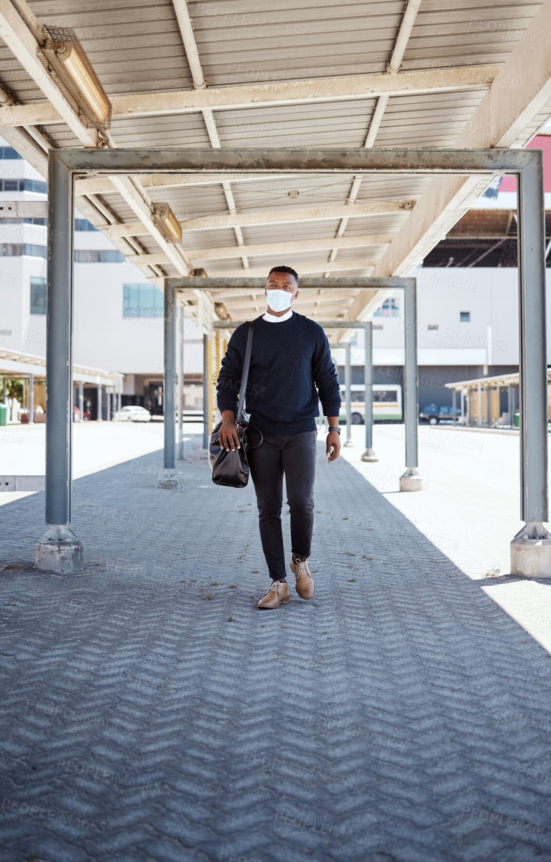 Buy stock photo Black man, walking and face mask for train travel with compliance, health safety and morning journey. Male person,  luggage and healthcare policy, commute delay and ppe protocol with subway transport