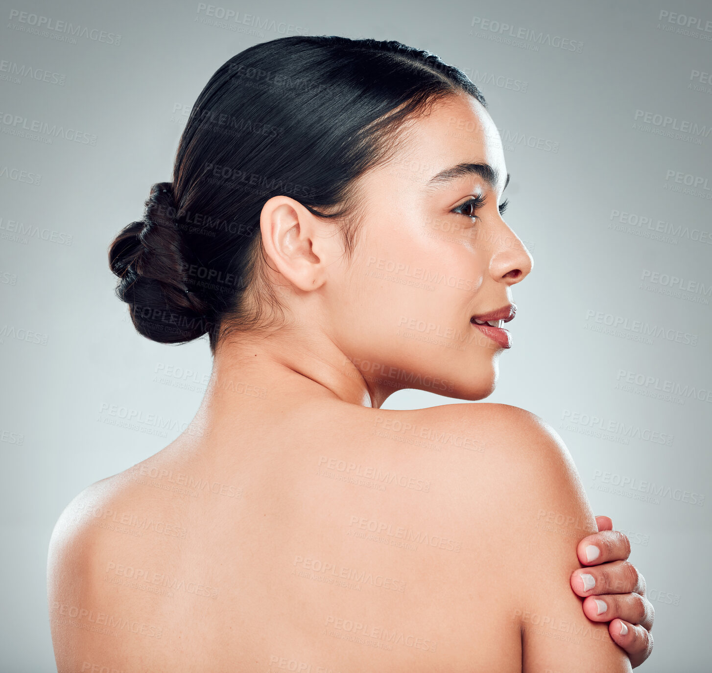 Buy stock photo Thinking, skincare and woman with glow, cosmetics and wellness on gray studio background. Shoulder, touch and model in spa with makeup for treatment results, dermatology or shine for beauty aesthetic