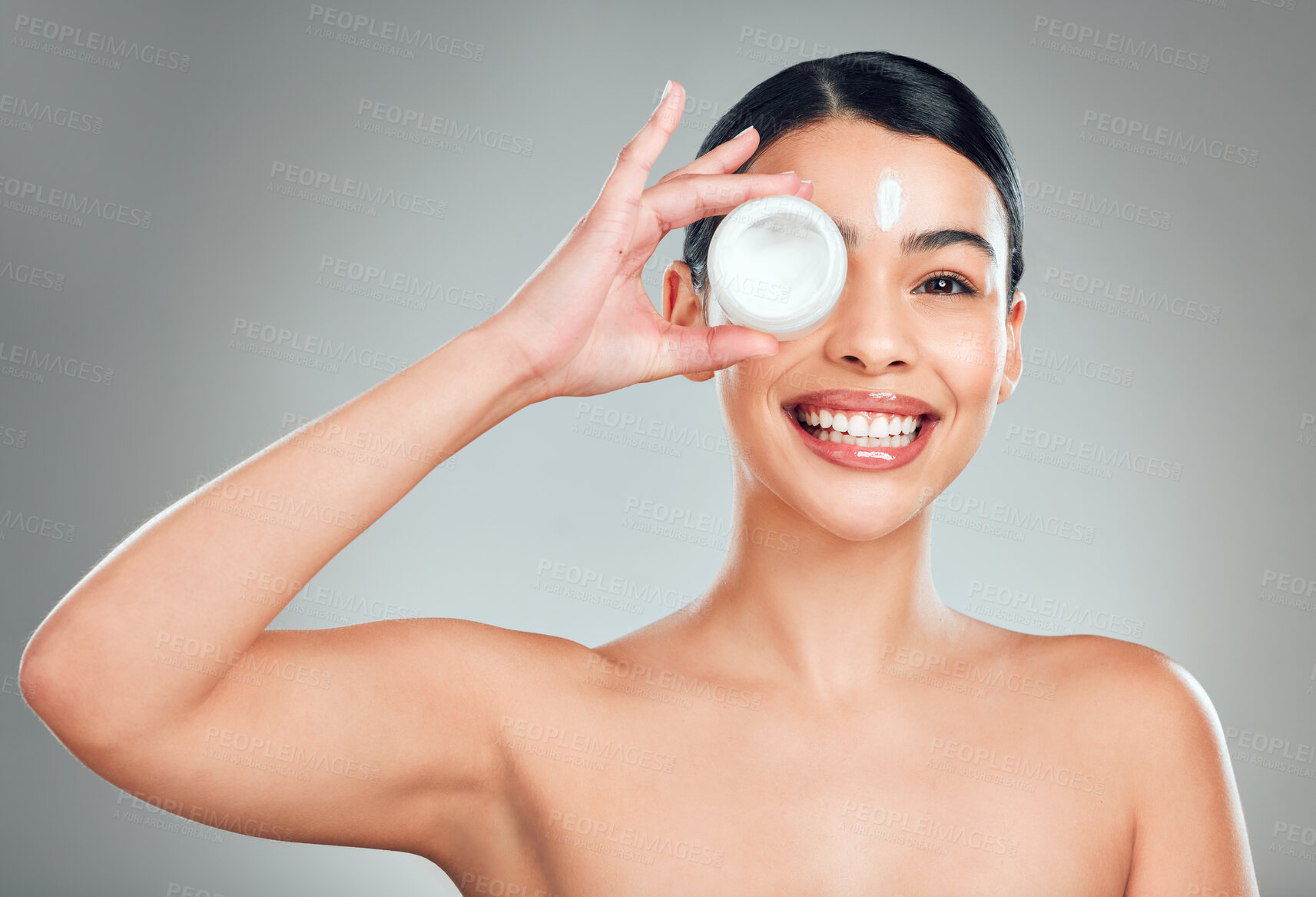 Buy stock photo Face cream, beauty and portrait of woman with skincare in studio with hydration and glow. Happy, health and female person from Cuba with moisturizer for facial dermatology routine by gray background