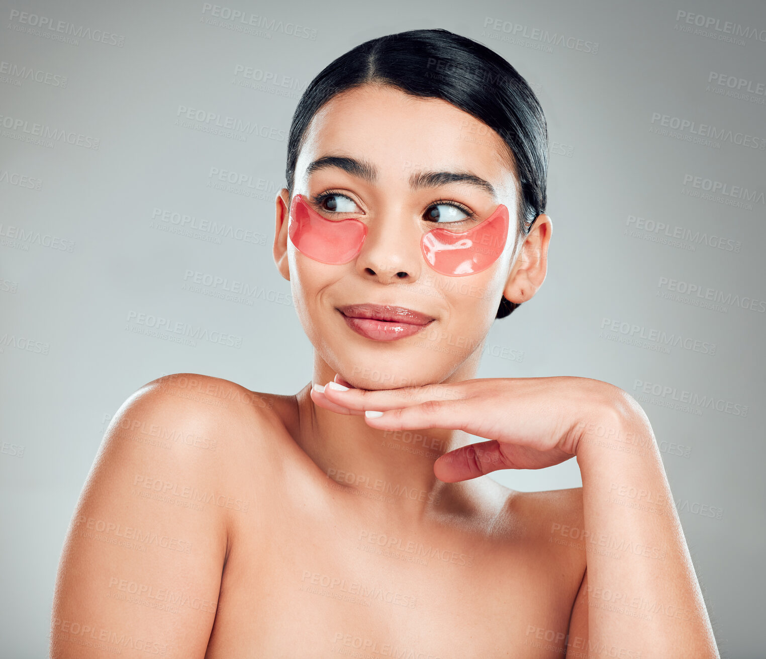 Buy stock photo Face, skincare and woman with patches for beauty, wellness  or facial treatment for hydration. Touch, cosmetics and model with eye mask for dermatology, glow and thinking on gray studio background