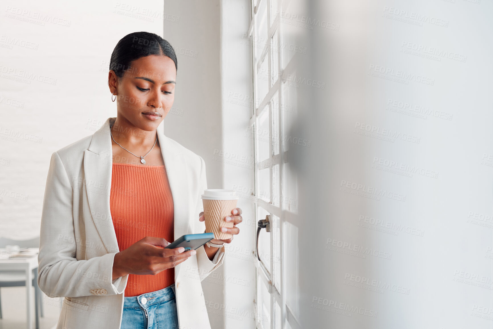 Buy stock photo Business, woman and coffee with phone in office for work break, text message and checking notifications. Professional, employee and smartphone by window with social media scroll or online browsing