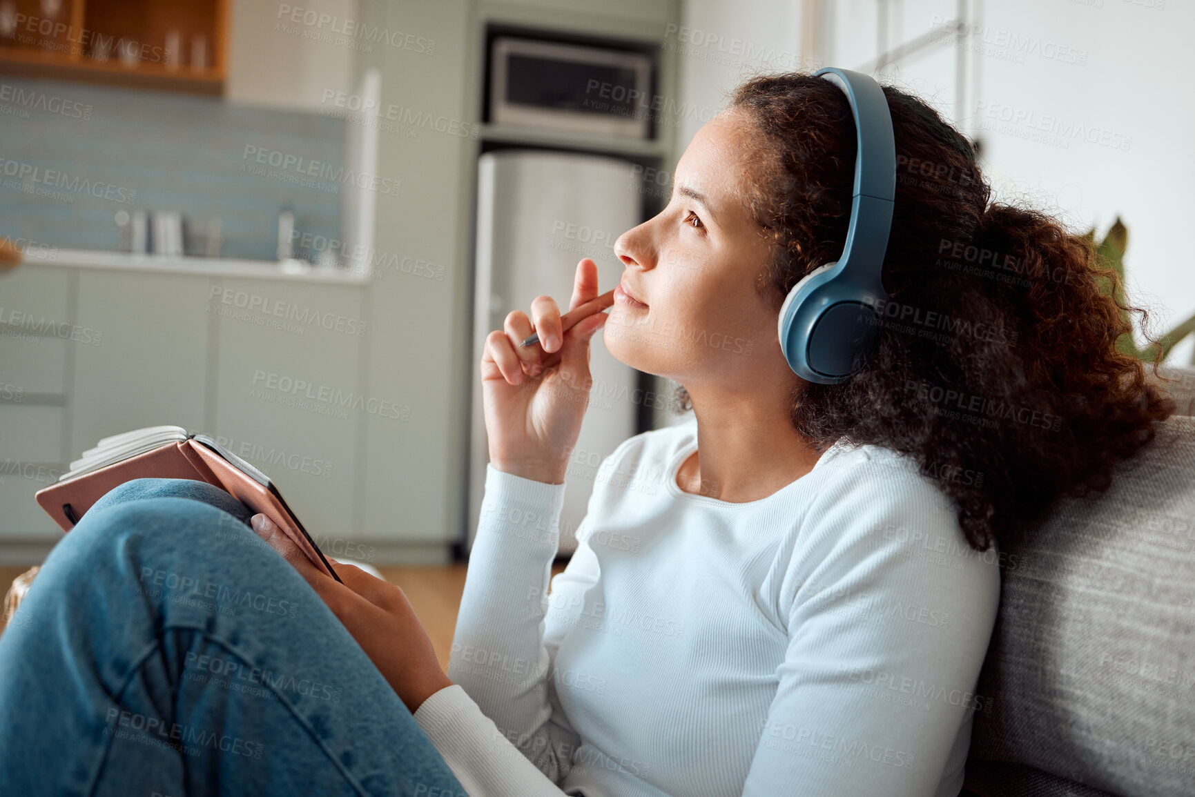 Buy stock photo Woman thinking, headphones and home for writing in book, podcast inspiration and gratitude journal. Female person, plan and streaming radio on floor of apartment, ideas and notepad for self care