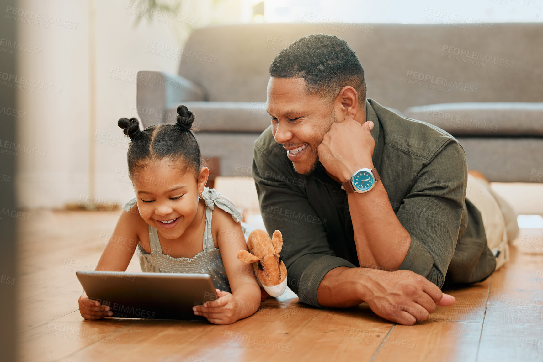 Buy stock photo Father, kid and tablet on floor in home for playing games, watching online cartoons and bonding together. Happy, man and girl on digital tech in lounge with movie entertainment on streaming service