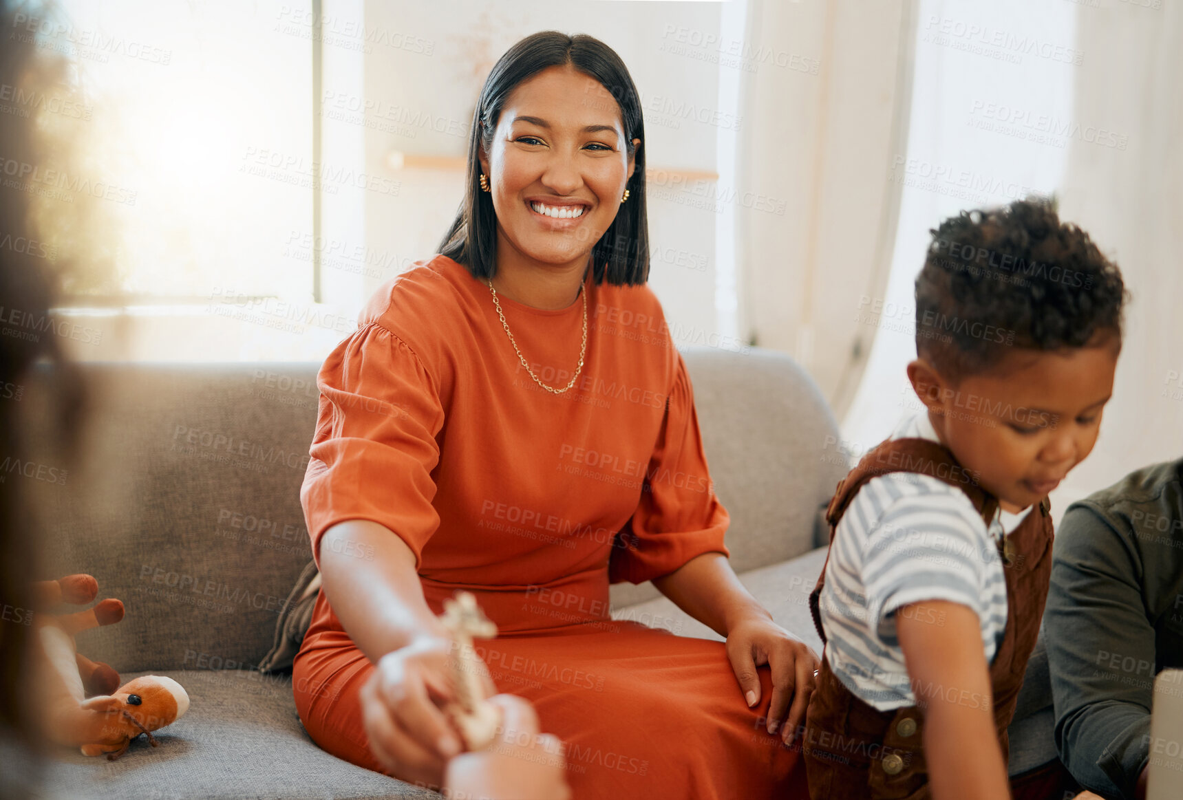 Buy stock photo Home, family and fun in living room with toy game, mother and African kid with bonding on sofa. Happy, weekend and smile with help, parents support and care with youth and morning in lounge with love