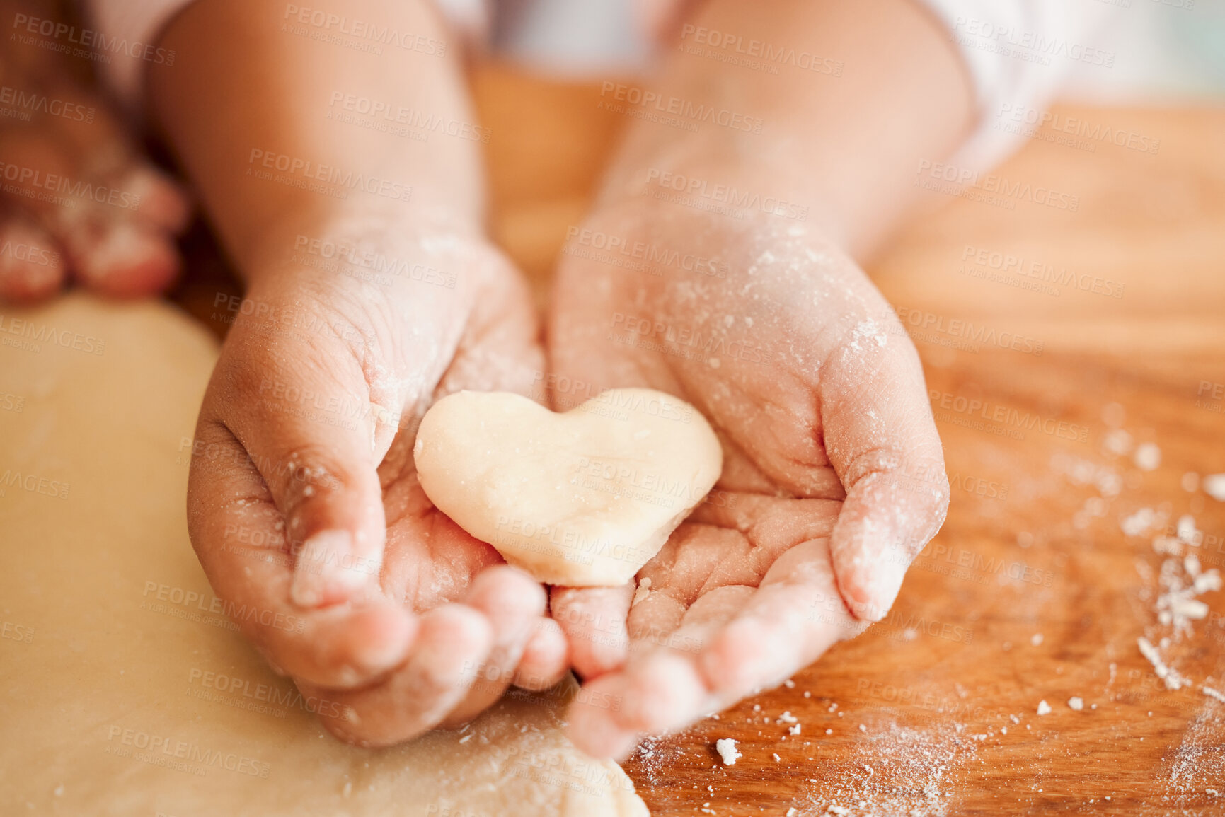 Buy stock photo Baking, heart and hands of child with dough for cake, treats and dessert for emoji, shape and symbol. Family, home and closeup of young kid with ingredients, recipe and pastry on kitchen counter